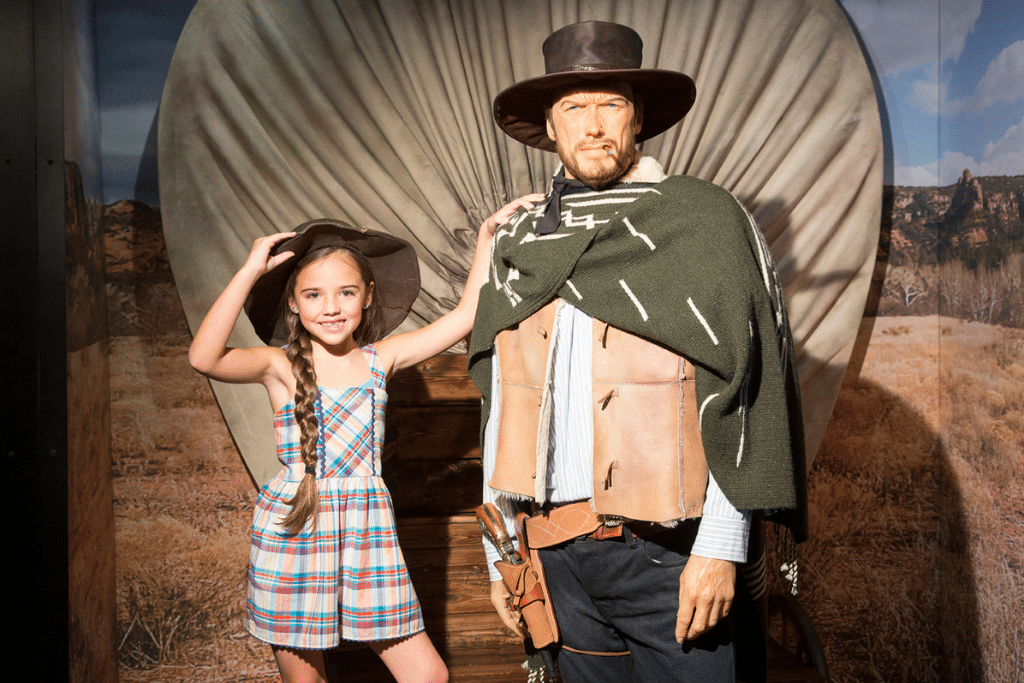 Little girl with Clint Eastwood wax figure at the Hollywood Wax Museum