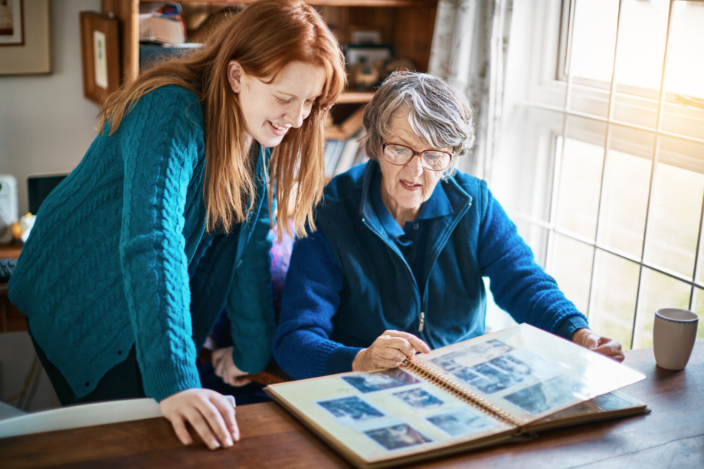 Senior looking at photo album