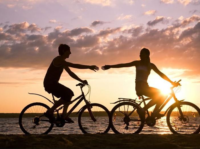 Couple bicycling together