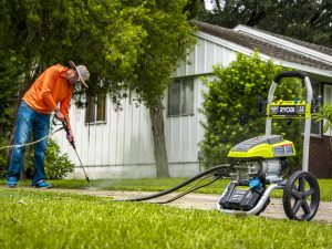 Man with pressure washer