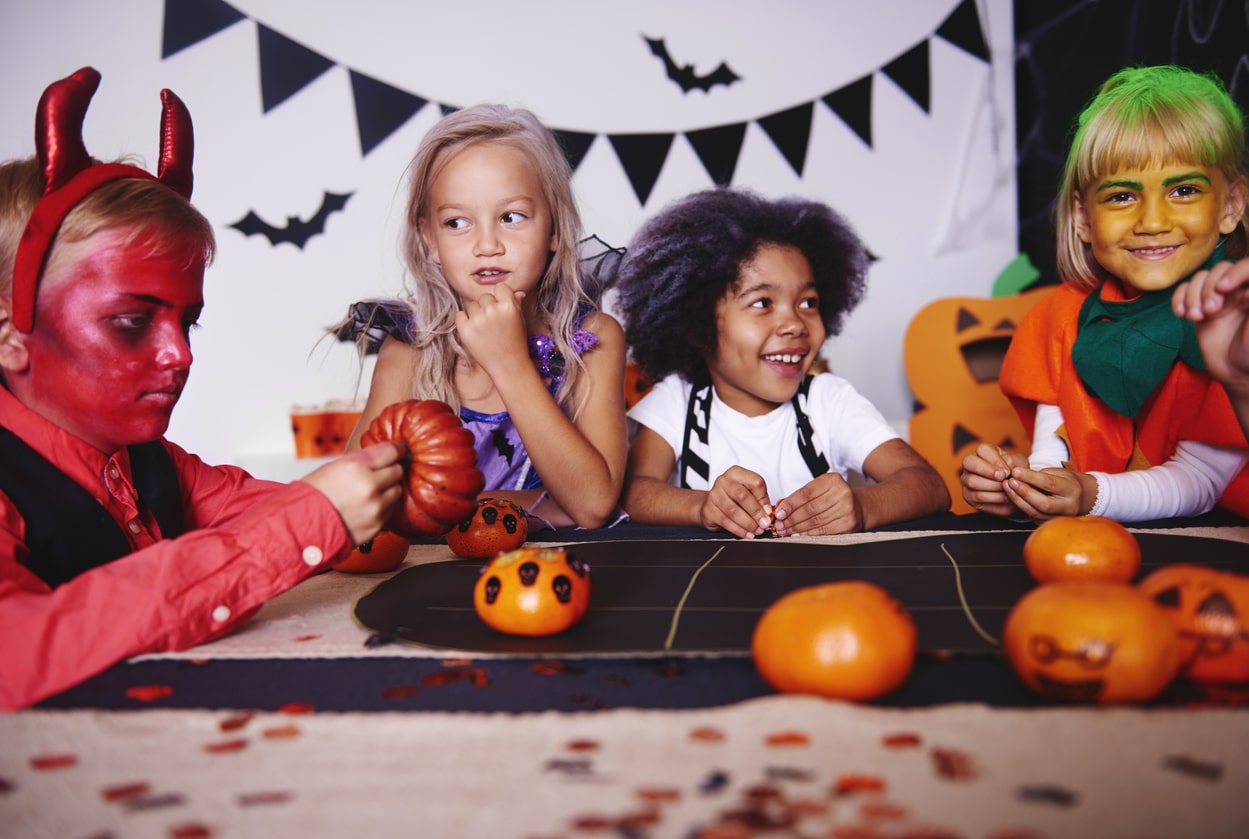 Children playing in costume at halloween party