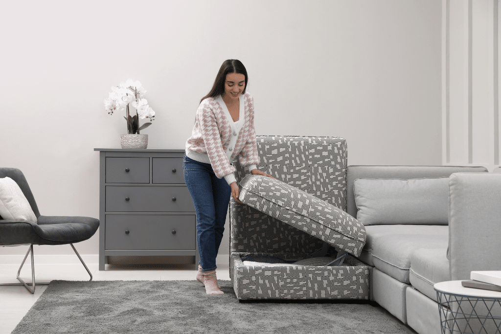 A person opening a couch for Newbury Park Storage Units. 