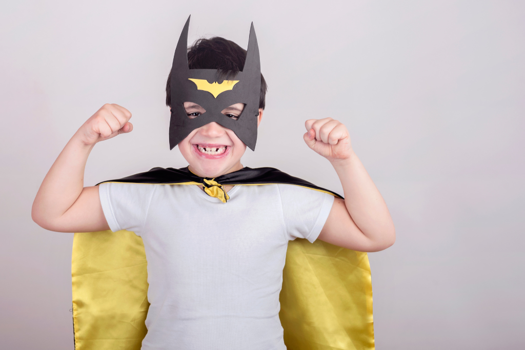 Boy dressed in a batman costume.
