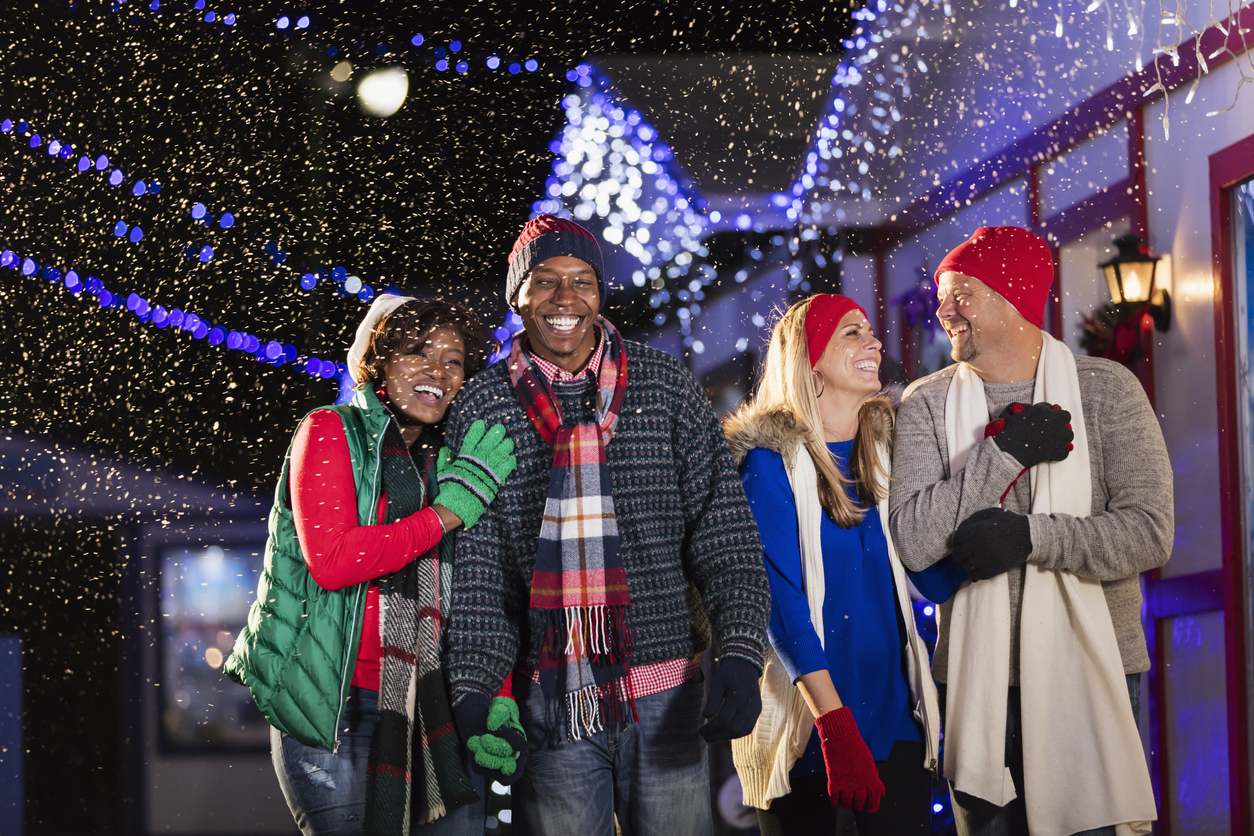 Multi-ethnic adults enjoying winter festival