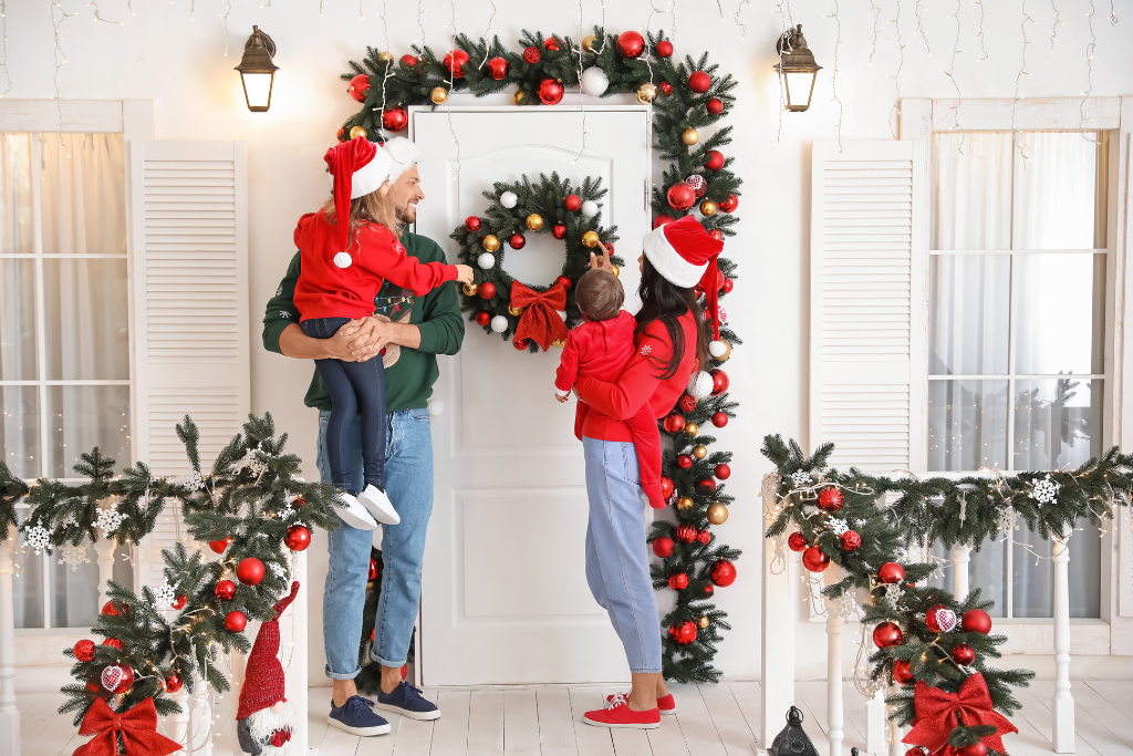 Family outside decorative home